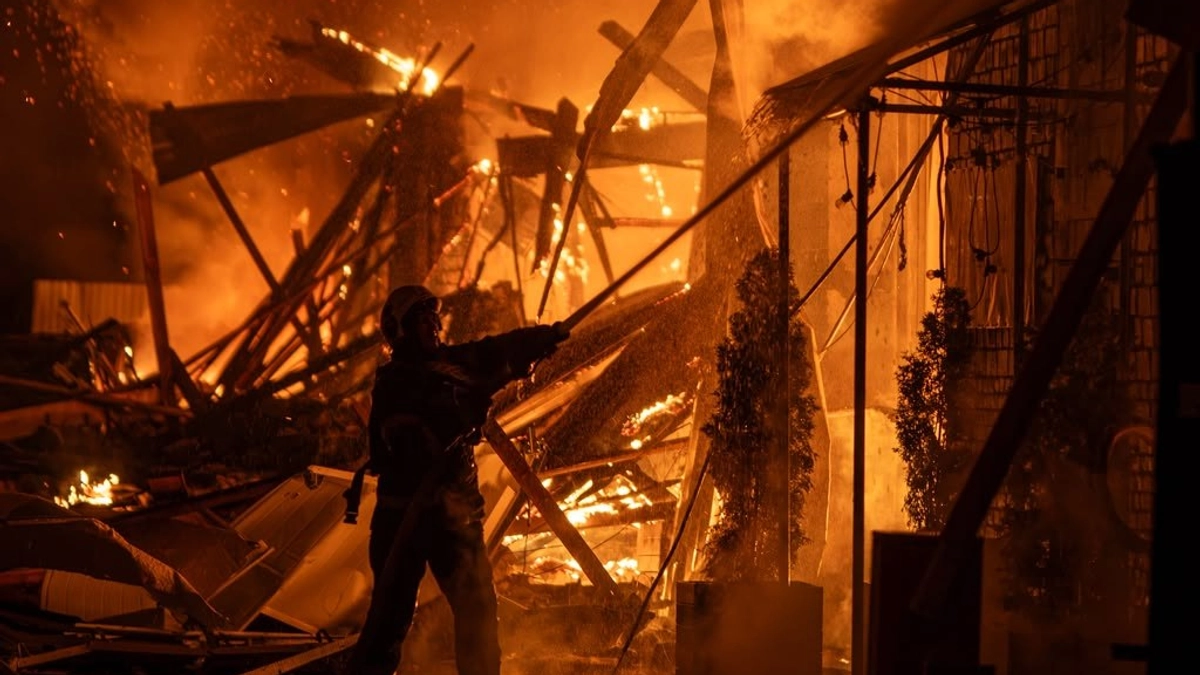 Man killed and vehicle repair shop catches fire in Russian attack on Kyiv